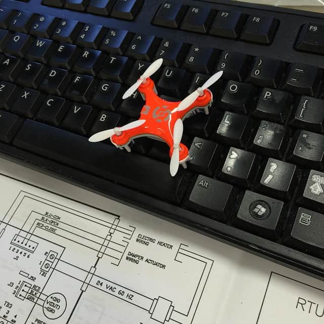 A picture of a small red drone